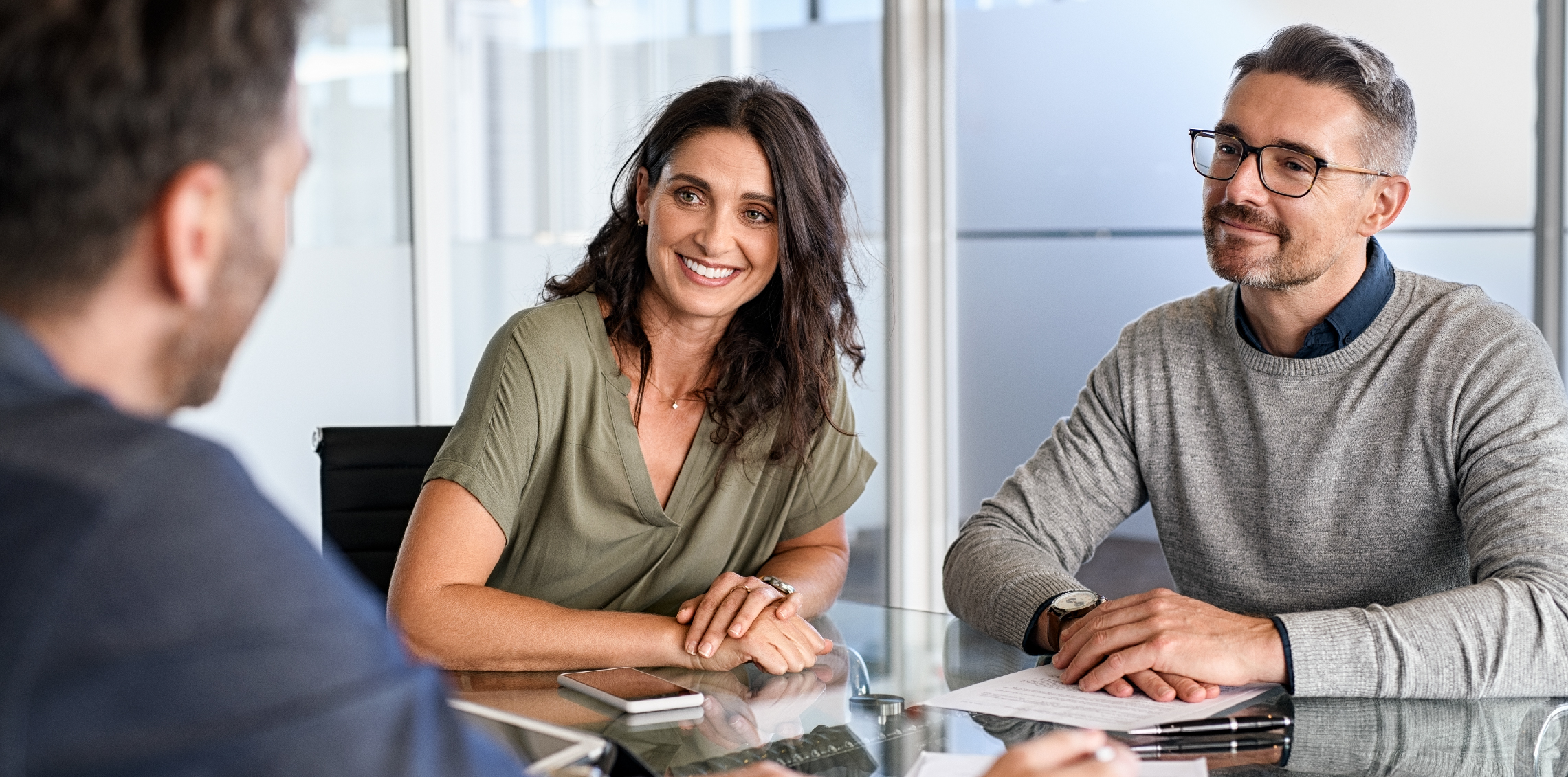 Couple speaking with advisor